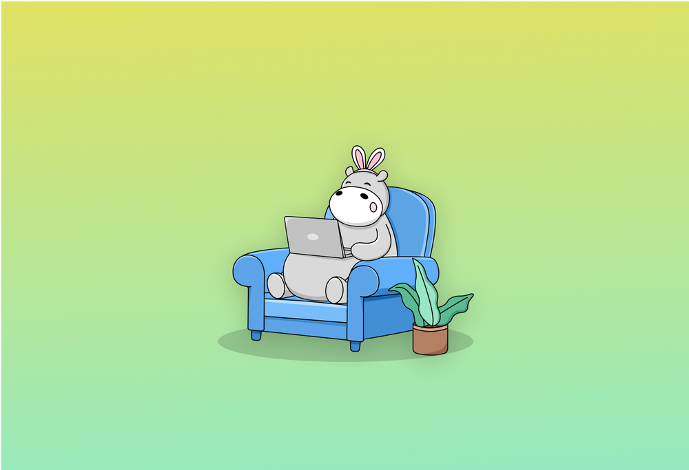 JPG hippo with bunny ears using a laptop while sitting on a sofa next to a plant
